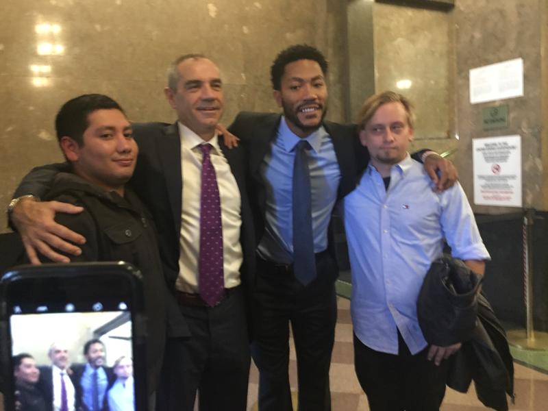 Jurors John and Jared pose with Derrick Rose and his attorney, Mark Baute, in the lobby of the federal courthouse in downtown Los Angeles. The jury had cleared Rose in the civil trial earlier in the day. Photo: Diana Moskovitz/Deadspin